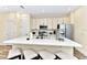 Spacious kitchen with stainless steel appliances, quartz countertops, and barstool seating at 3205 Caribbean Soul Dr, Kissimmee, FL 34747