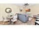 Comfortable living area with dining table, flatscreen TV, and stylish decor with wood look flooring at 3205 Caribbean Soul Dr, Kissimmee, FL 34747