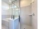 This bathroom features a bathtub, a shower, and a towel rack at 3273 Lilac Way, Davenport, FL 33897