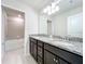 Bathroom with dual sinks, granite countertop, and ample storage at 3273 Lilac Way, Davenport, FL 33897