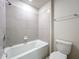 Bright bathroom with tiled shower, bathtub, and modern fixtures at 3273 Lilac Way, Davenport, FL 33897