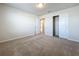 Bright bedroom features carpeted floors, a large window, and a walk in closet at 3273 Lilac Way, Davenport, FL 33897