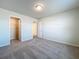 Neutral bedroom featuring carpeted floors, closet and ensuite doors, and recessed lighting at 3273 Lilac Way, Davenport, FL 33897