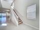 Spacious foyer with staircase, tile flooring, and view to the backyard at 3273 Lilac Way, Davenport, FL 33897