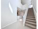 Bright foyer with staircase, tile flooring, and open view to the kitchen at 3273 Lilac Way, Davenport, FL 33897