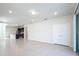 View of living room with tile flooring, recessed lighting, and view into kitchen area at 3273 Lilac Way, Davenport, FL 33897