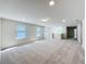 Bright and airy upstairs loft features neutral carpet and large windows for ample light at 3273 Lilac Way, Davenport, FL 33897