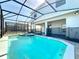 This home has a beautiful, private screened-in pool and patio with a connected hot tub for entertaining at 3273 Lilac Way, Davenport, FL 33897
