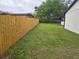 Expansive backyard featuring a new wooden fence and ample green space at 383 Floral Dr, Winter Garden, FL 34787