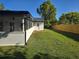 Spacious backyard with a new wooden fence and screened patio, perfect for outdoor entertaining and privacy at 383 Floral Dr, Winter Garden, FL 34787