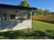 Backyard with new wooden fence and screened patio, offering privacy and a comfortable outdoor space at 383 Floral Dr, Winter Garden, FL 34787