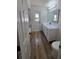 Bathroom featuring modern white vanity, mirror, lighting, and door to the outside at 383 Floral Dr, Winter Garden, FL 34787