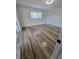 Cozy bedroom with hardwood flooring and a sliding glass door leading to a patio at 383 Floral Dr, Winter Garden, FL 34787