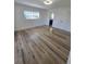 Bedroom features hardwood flooring and access to a connecting bathroom at 383 Floral Dr, Winter Garden, FL 34787