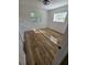 Cozy bedroom with hardwood flooring and natural light streaming through the two windows at 383 Floral Dr, Winter Garden, FL 34787