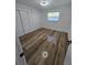 Bedroom with hardwood flooring, a closet, and a window providing ample natural light at 383 Floral Dr, Winter Garden, FL 34787