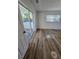 Inviting bedroom with sliding glass door leading to a patio, and featuring hardwood floors at 383 Floral Dr, Winter Garden, FL 34787