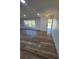 Well-lit entryway boasts hardwood floors and a decorative light fixture, creating a welcoming ambiance at 383 Floral Dr, Winter Garden, FL 34787