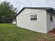 Exterior side view featuring new landscaping details at 383 Floral Dr, Winter Garden, FL 34787