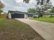 Charming single-story home with well-maintained lawn and extended driveway at 383 Floral Dr, Winter Garden, FL 34787