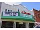 The historic Garden Theater with its vibrant SUMMER MOVIES Thurs & Sun advertisement at 383 Floral Dr, Winter Garden, FL 34787
