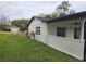 Exterior angle showing the home's enclosed patio and detached garage at 383 Floral Dr, Winter Garden, FL 34787