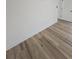 Stylish wood-look flooring in a bright, open space adding warmth and elegance at 383 Floral Dr, Winter Garden, FL 34787