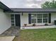Inviting home exterior showcasing a walkway, tidy landscaping and clear numbering at 383 Floral Dr, Winter Garden, FL 34787