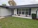 Charming home exterior featuring black shutters, a new walkway and fresh landscaping at 383 Floral Dr, Winter Garden, FL 34787