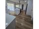 Open-concept kitchen with island cooktop, stainless steel appliances, and natural light at 383 Floral Dr, Winter Garden, FL 34787