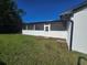 Screened patio featuring a door to backyard and a paver stone landing at 383 Floral Dr, Winter Garden, FL 34787