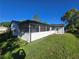 Spacious patio with screens and access to the yard and home's exterior at 383 Floral Dr, Winter Garden, FL 34787