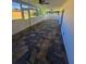 Screened-in patio with ceiling fans and stone-look tile flooring at 383 Floral Dr, Winter Garden, FL 34787