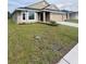 Charming single-story home featuring a bay window, neutral stucco exterior, and an attached two-car garage at 4236 Sagefield Dr., St Cloud, FL 34773