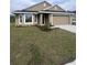 Charming single-story home featuring a bay window, neutral stucco exterior, and attached two-car garage at 4236 Sagefield Dr., St Cloud, FL 34773