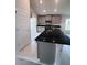 Spacious kitchen featuring stainless steel appliances, granite countertops, gray cabinets, and a large island at 4236 Sagefield Dr., St Cloud, FL 34773