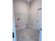 A functional laundry room offers tile flooring, shelving, and convenient hookups at 4236 Sagefield Dr., St Cloud, FL 34773