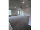Bright, open living room features carpeted floors, neutral paint, ceiling fan, and plenty of natural light at 4236 Sagefield Dr., St Cloud, FL 34773