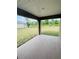 Outdoor patio featuring a concrete slab and scenic views of the green backyard at 4236 Sagefield Dr., St Cloud, FL 34773