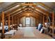 Spacious unfinished attic with exposed beams, a window, and ample storage potential at 4240 Lake Harney Cir, Geneva, FL 32732