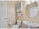 Cozy half bathroom with built-in storage and a modern sink at 4240 Lake Harney Cir, Geneva, FL 32732