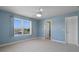 Light and airy bedroom featuring a ceiling fan and a view of the waterfront at 4240 Lake Harney Cir, Geneva, FL 32732