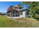 Exterior angle features a screened porch with an upper deck, providing outdoor leisure space at 4240 Lake Harney Cir, Geneva, FL 32732
