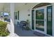 Inviting front entrance featuring a stylish door with glass, a 'Welcome' mat, and a cozy seating area at 4240 Lake Harney Cir, Geneva, FL 32732