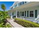 Charming front porch with ample seating, framed by lush greenery and offering a welcoming entrance at 4240 Lake Harney Cir, Geneva, FL 32732
