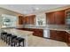 Open kitchen with extensive granite countertops, stylish cabinetry, and modern stainless steel appliances for a gourmet experience at 4240 Lake Harney Cir, Geneva, FL 32732