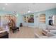 Spacious living area with built-in shelves, tile floors, and a staircase leading to the upper level at 4240 Lake Harney Cir, Geneva, FL 32732