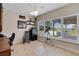 Bright office space with large window, tiled floors, and outdoor views at 4240 Lake Harney Cir, Geneva, FL 32732