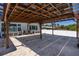 Covered brick patio features a wood pergola with lights, perfect for outdoor entertaining at 4240 Lake Harney Cir, Geneva, FL 32732
