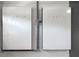 Dual Tesla Powerwall units mounted on a gray wall for home energy storage solutions at 4240 Lake Harney Cir, Geneva, FL 32732